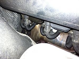 When car idles, smell oil - under hood see oil staining on tank, blwn head gasket??-photo-1-.jpg