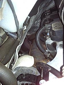 When car idles, smell oil - under hood see oil staining on tank, blwn head gasket??-photo.jpg