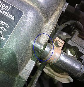 Coolant hose/nipple on expansion tank appears to be cracked. Is this normal?-image_1.jpeg