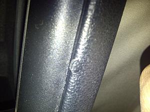Should a rip in armrest of the door panel be under warranty?-img-20121024-00040.jpg