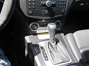Anyone have a C63 with Factory Carbon fiber Package???-console-w-sticker.jpg