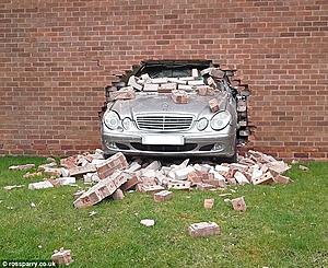 Awesome pic W211 vs brick wall-2701097600000578-0-image-m-60_1427370380901.jpg