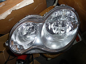 Parting out car FS: emblem, headlight, cd changer magazine-driver_front.jpg