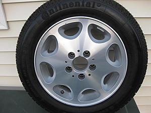 eight hole  W124 e Class wheel and tire.-img_0220.jpg