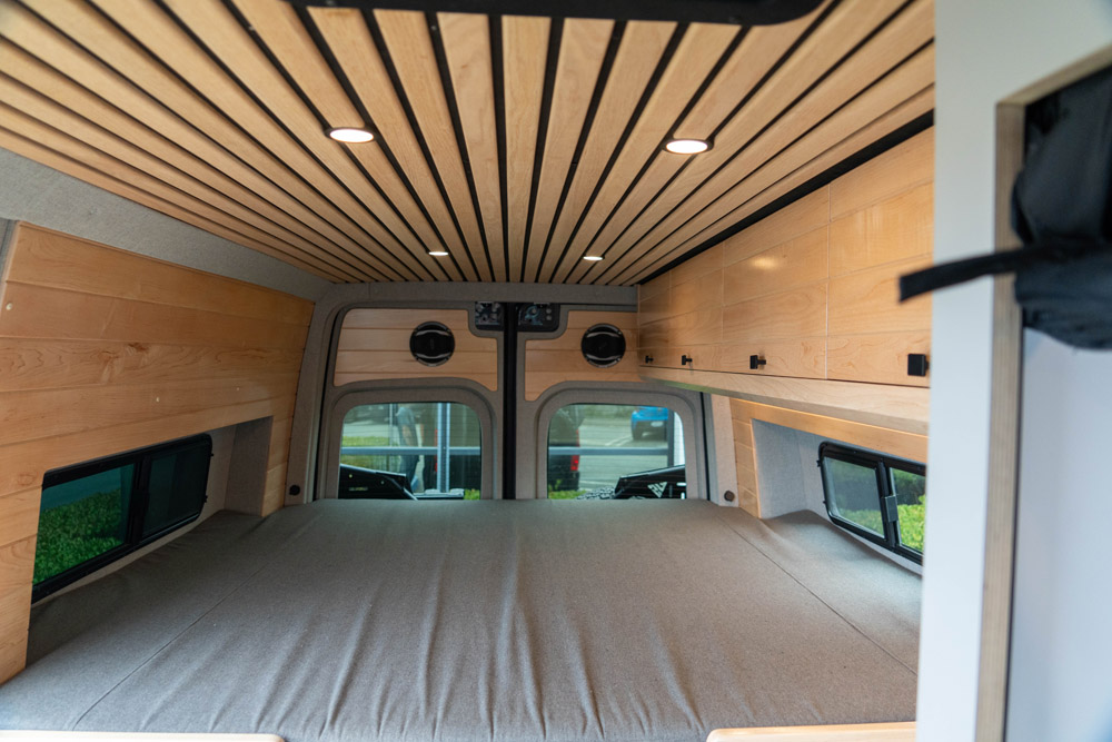 Vanspeed conversion van interior bed loft rear view