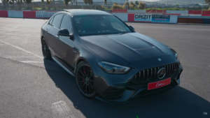 A black Mercedes-AMG C63 S parked under the sun.