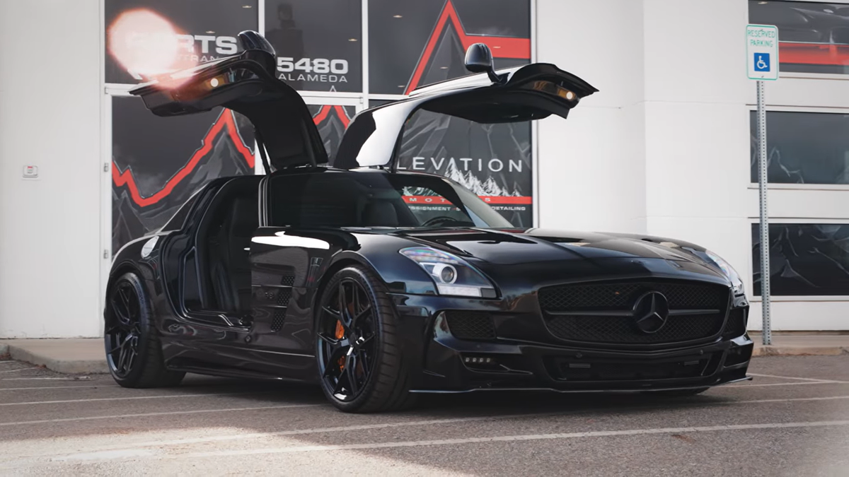 A Weistec supercharged 2011 Mercedes-Benz SLS AMG in black with black wheels.