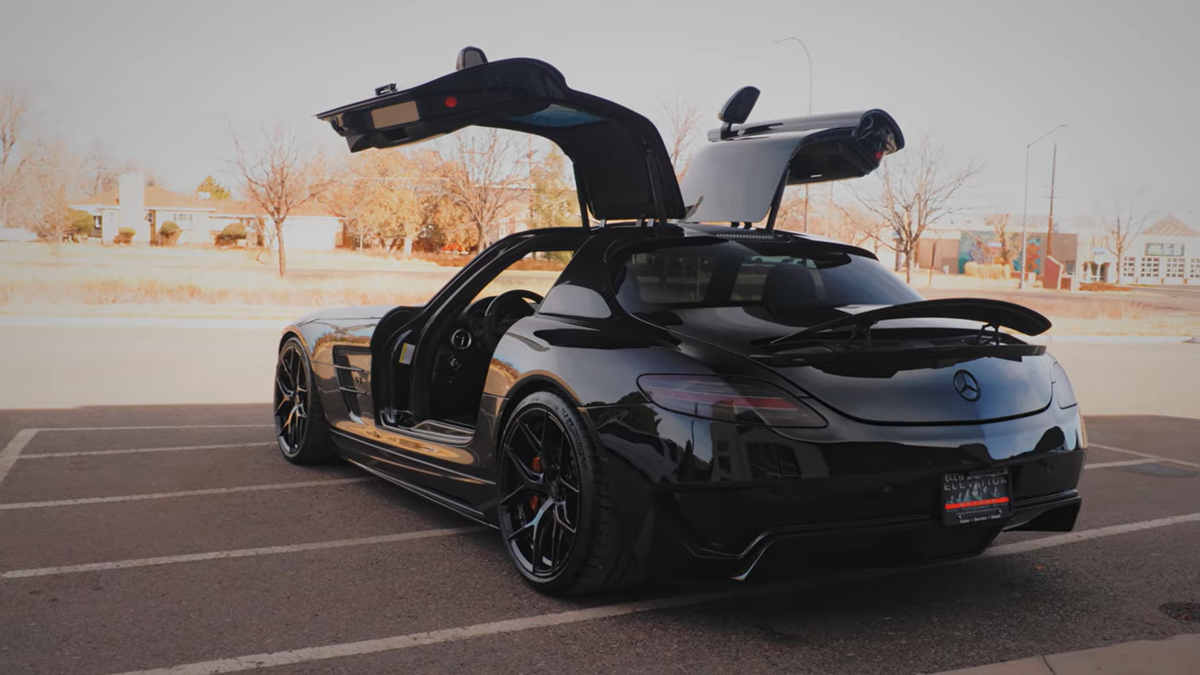 A Weistec supercharged 2011 Mercedes-Benz SLS AMG in black with black wheels.