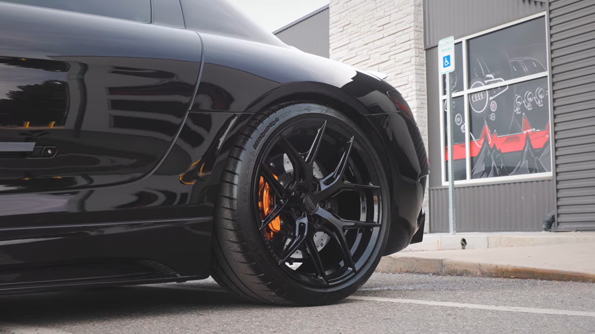 A Weistec supercharged 2011 Mercedes-Benz SLS AMG in black with black wheels.